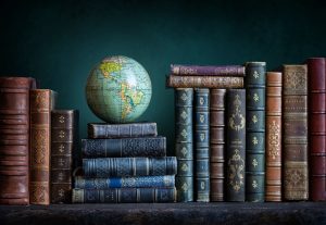 old,geographical,globe,and,old,book,in,cabinet,with,bookselfs.